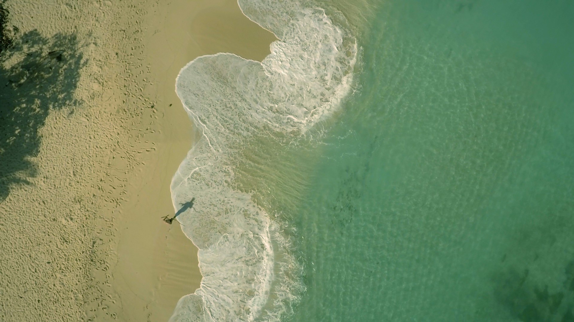 Aerial of beach walker in Luperon, DR